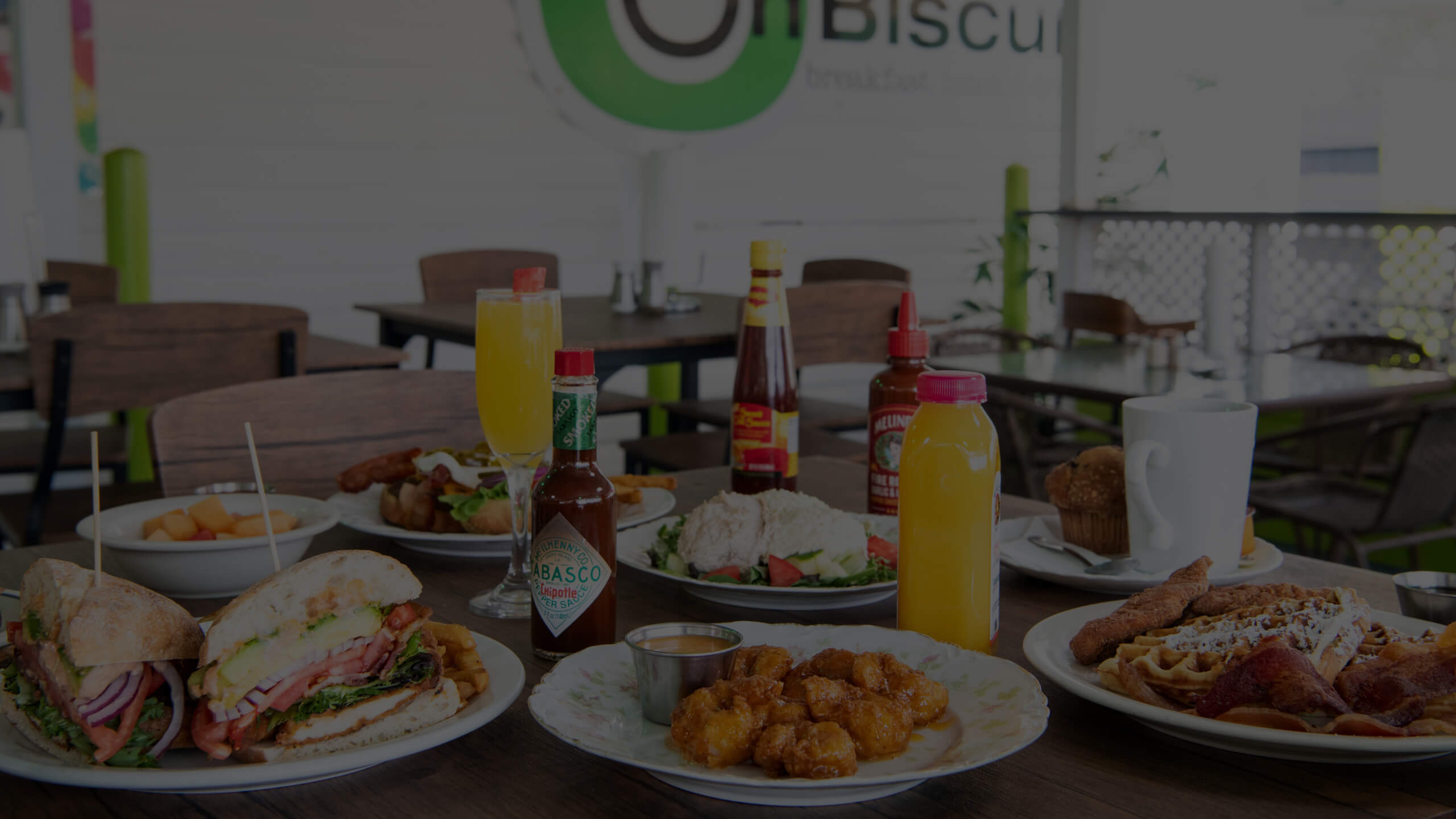 A table with various breakfast foods and drinks.